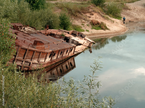 GOMEL, BELARUS old rusty metal river barge on the bay