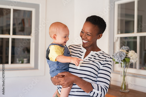 African mother holding adopted child