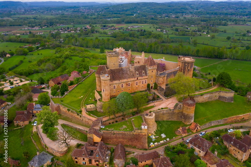 Sunset in front of a Castle. Château de Castelnau-Bretenoux is a castle in the commune of Prudhomat, Lot département, France. One of the most impressive in the Quercy region, Prudhomat, Lot department photo