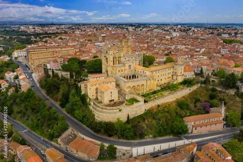 Aerial view of old bridge and Cathedral Saint Nazaire in the Beziers town. Cathedral built in the XIV century. France