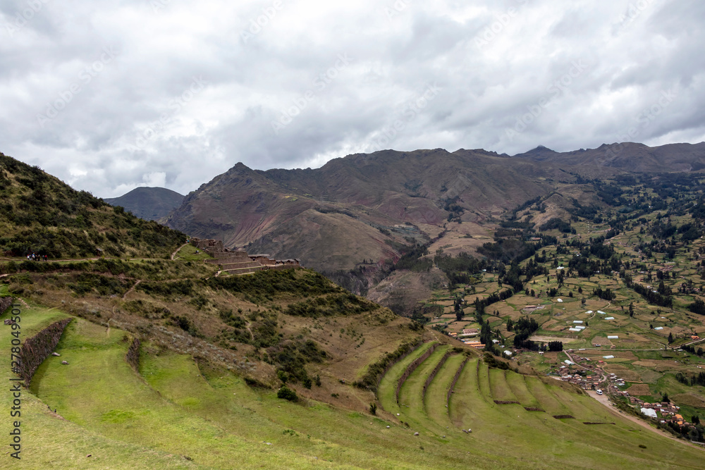 Obraz premium View of Pisac Archaeological Park and green mountains of the Sacred Valley of the Incas, Peru