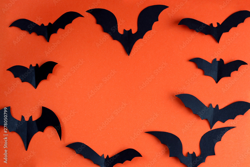 Halloween holiday concept with paper black bats. Halloween holiday concept with paper black bats.