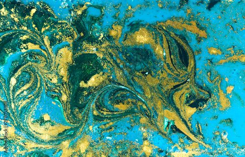 Liquid uneven blue and green marbling pattern with golden glitter and glare of light © anya babii