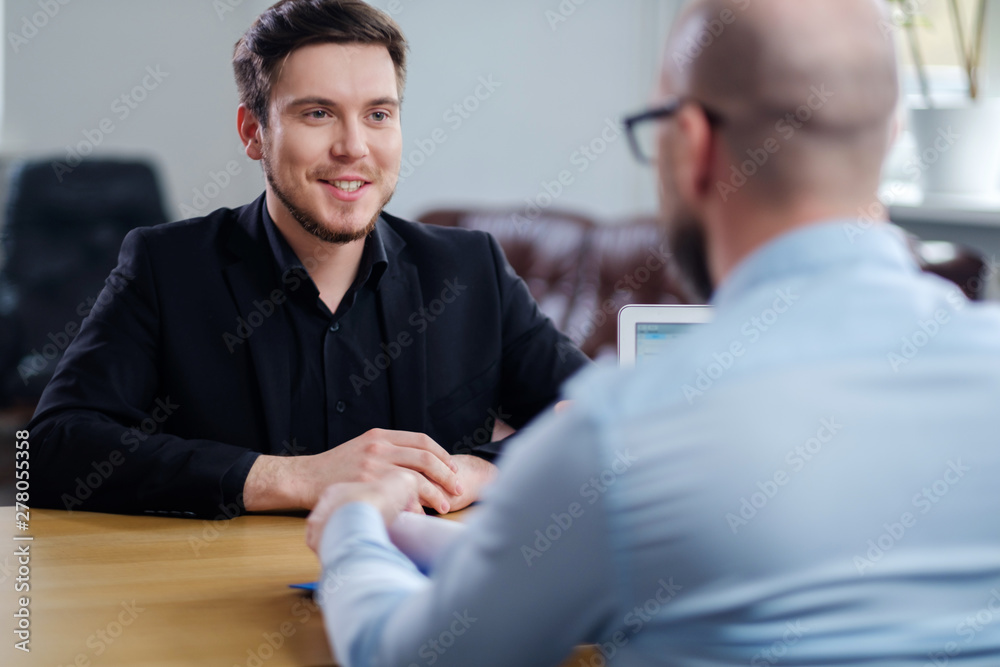 Confident young man attending job interview - obrazy, fototapety, plakaty 