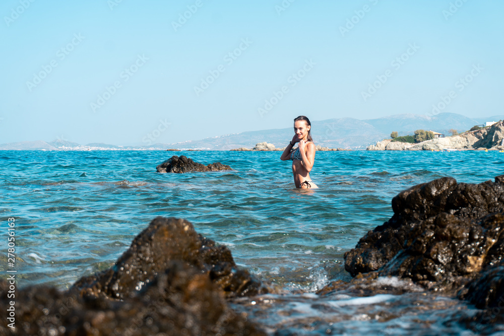 Cutie girl having fun in sea summer time