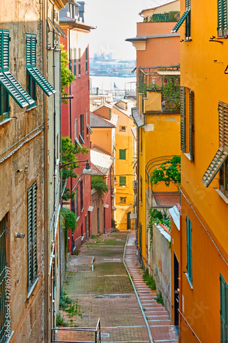 Old downhill street leading to the port in Genoa photo