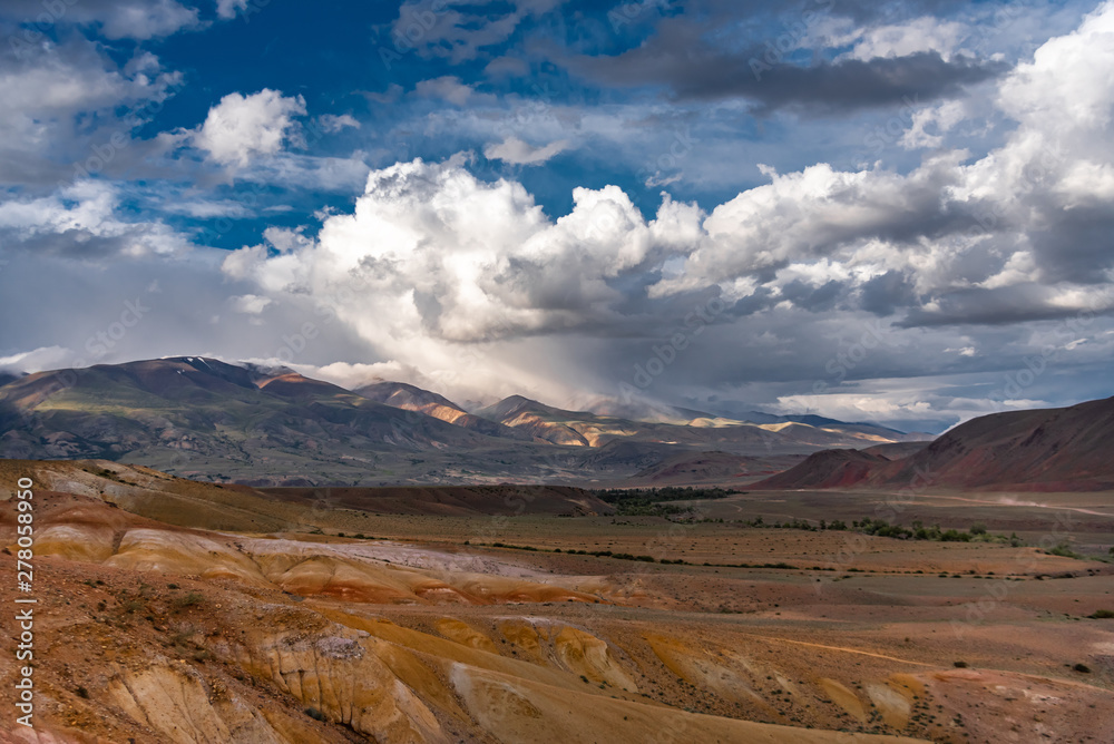 Mountain landscape. Colored mountains. Clay mountains. Cloudy sky. Altai.