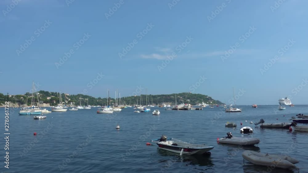 Boats and yachts in Villefranche-Sur-Mer, Provence-Alpes-COTE DAZUR, France on August 23, 2018. Wide Shot. Boats and yachts in Villefranche-Sur-Mer, Provence-Alpes-COTE DAZUR, France on August 23, 2018. Wide Shot.