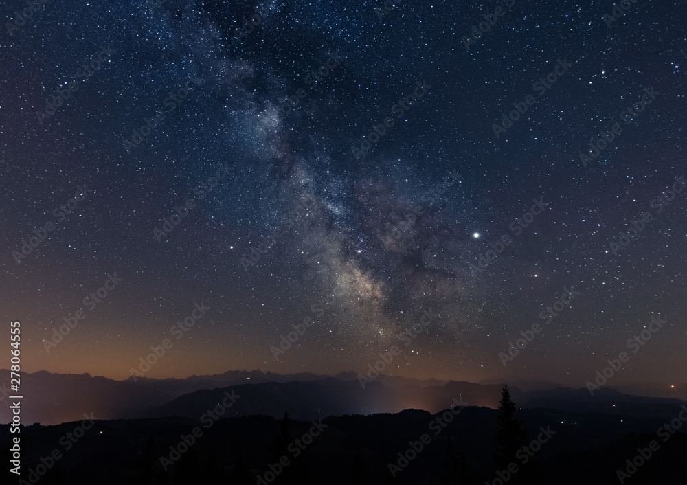 milky way rising above swiss mountains