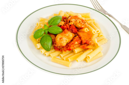 Pasta with pieces of chicken, tomatoes and sweet paprika.