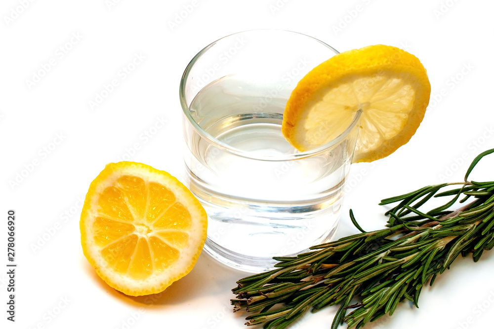 Glass of pure water with lemon isolated on a white background Glass of pure water with lemon isolated on a white background