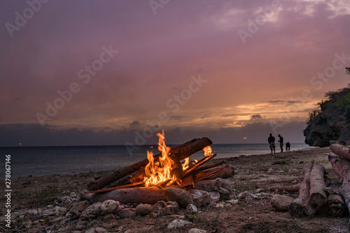 A fantastic sunset at the beach with a bonfire and BBQ on the island of Curacaio photo