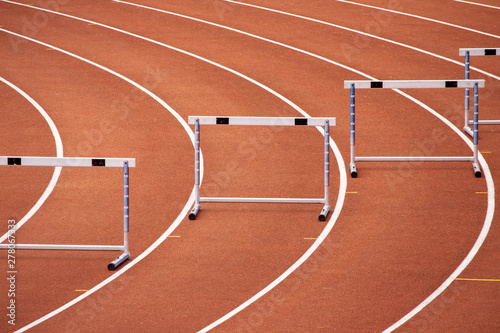 Hurdles on a bend of an athletics stadium race track photo