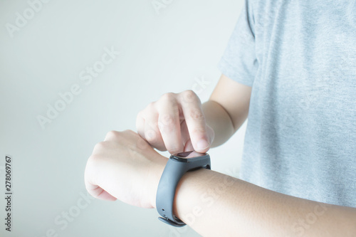 Women use touch hands on the black smartwatch screen in your hand.