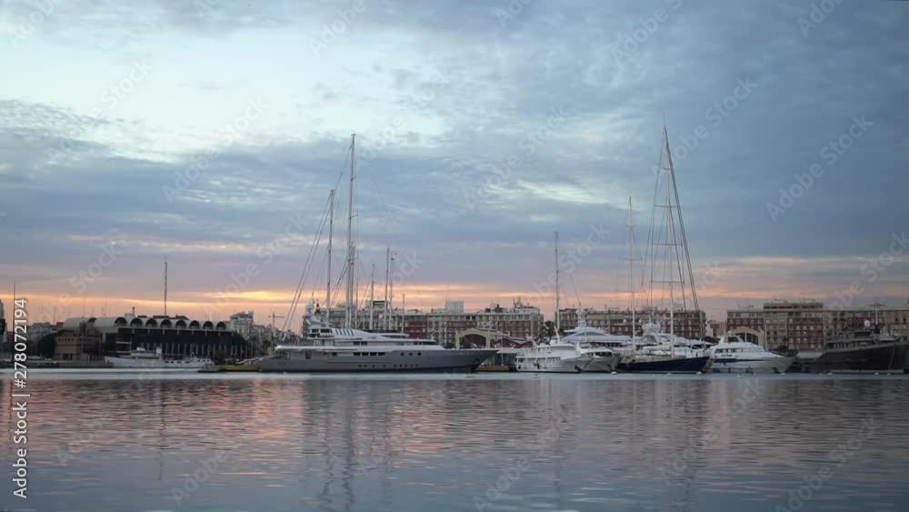 time lapse, view of the port of Valencia Spain, sunset, yachts are in the port time lapse, view of the port of Valencia Spain, sunset, yachts are in the port