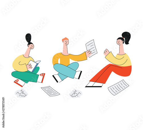 A group of students sitting on the floor with notes.