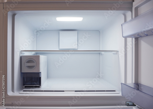 Inside of empty and clean modern refrigerator