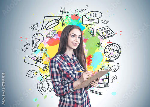 Smiling teen girl with clipboard, education