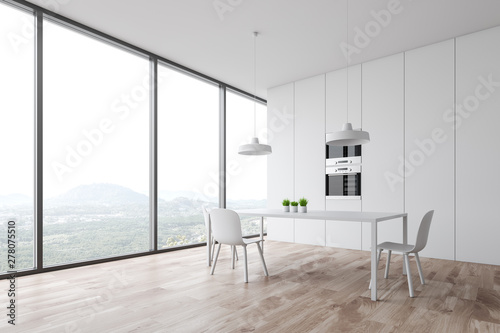 White minimalist kitchen corner with table