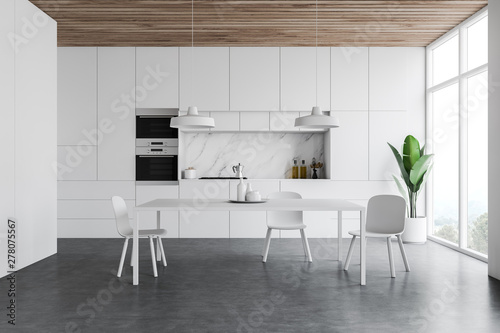 White kitchen interior, counters and table