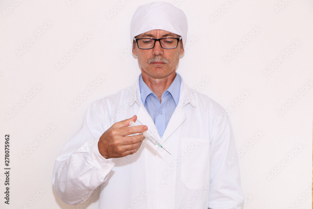 Health - Doctor holds a syringe for vaccination Health - Doctor holds a syringe for vaccination
