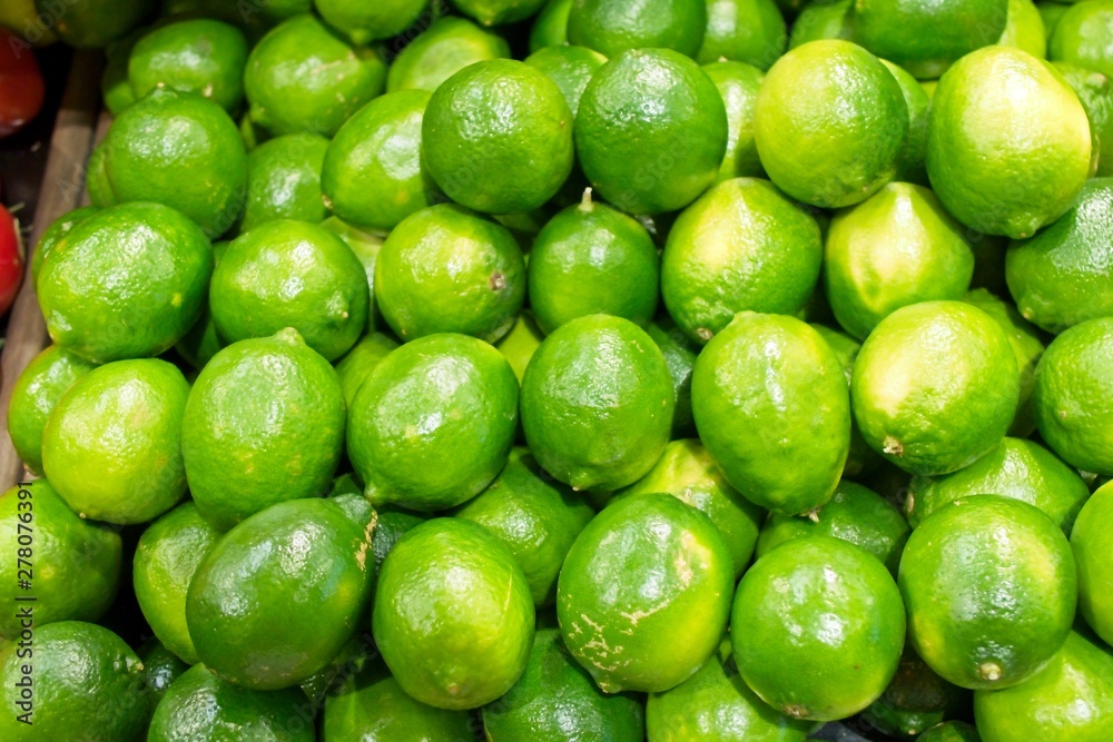 Fresh, tangy Limes on display at a grocery store. Fresh, tangy Limes on display at a grocery store.