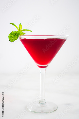 Red Cocktail with Mint Garnish