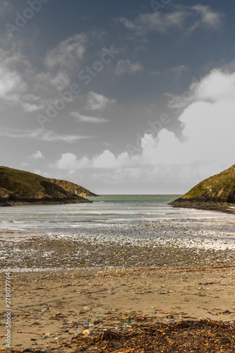 Looking to sea small natural harbour, Abercastle, portrait. photo