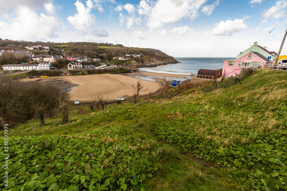 Looking to village and small natural harbour, Aberporth.