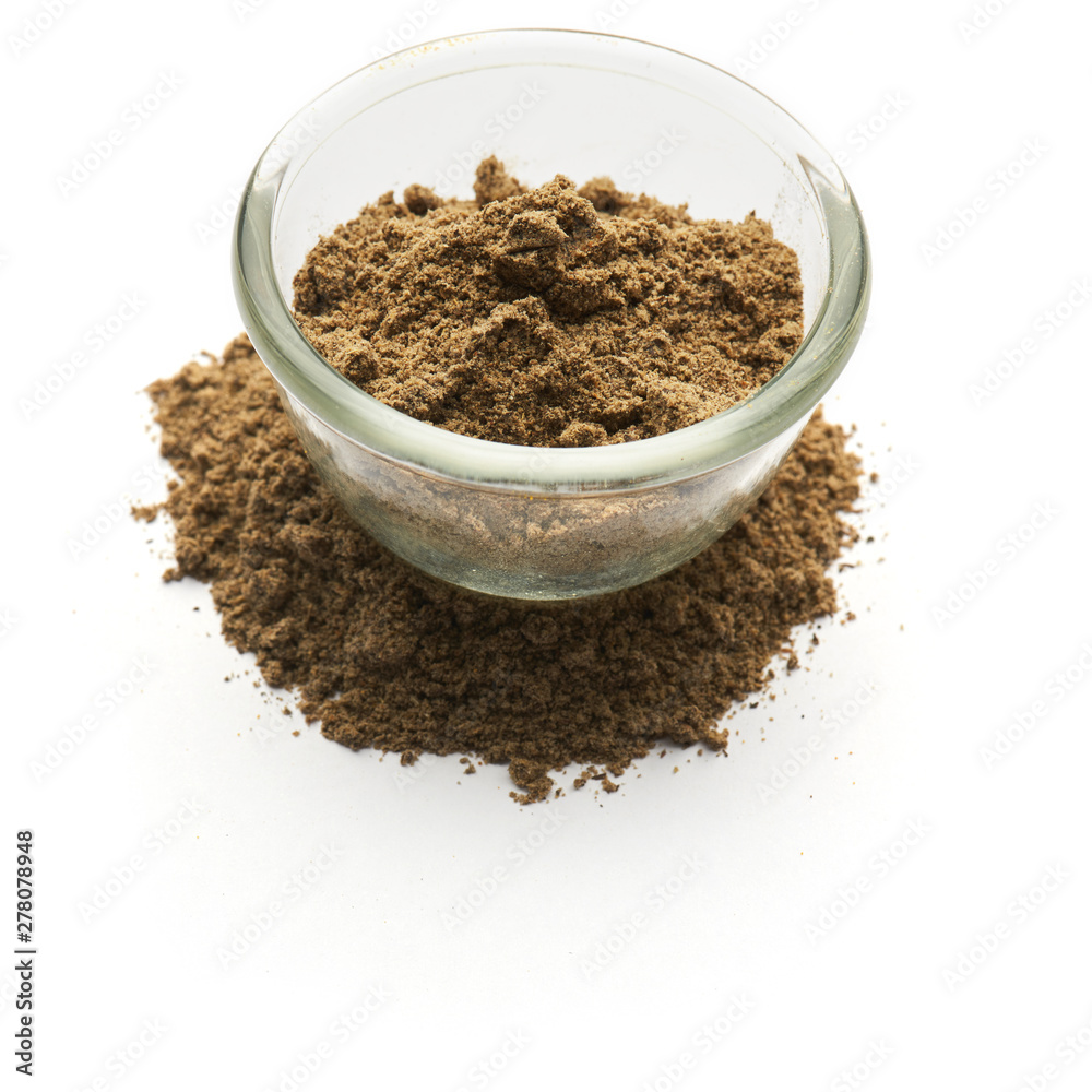 ground black pepper isolated in a glass plate ground black pepper isolated in a glass plate