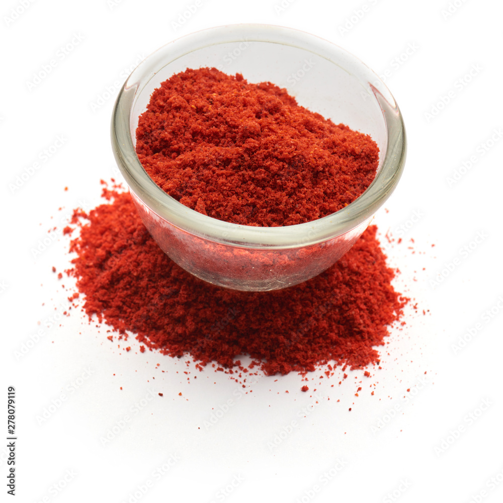 ground paprika isolated in a glass plate ground paprika isolated in a glass plate