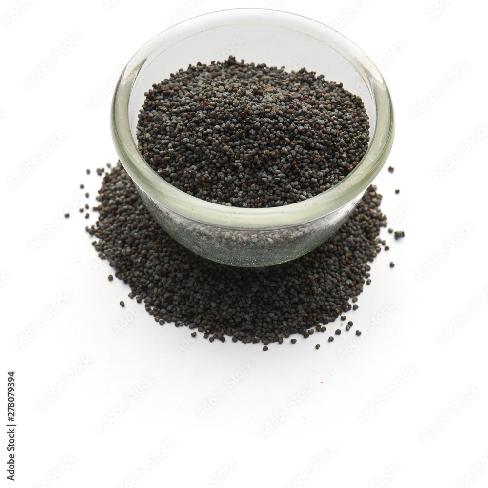poppy seeds isolatedin a glass plate poppy seeds isolatedin a glass plate