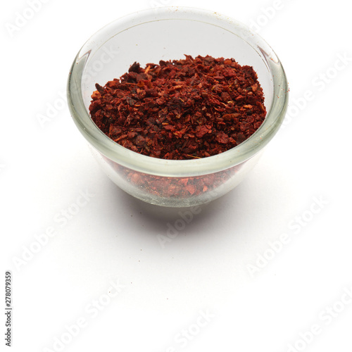 crushed dried tomato isolated a glass plate