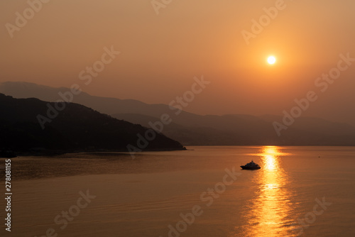 Sunrise over the sea and mountains