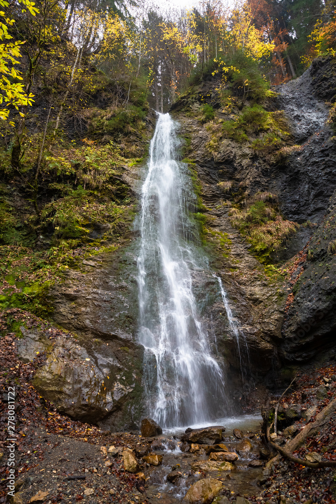 Fototapeta premium Waterfall in the forest in Tyrol
