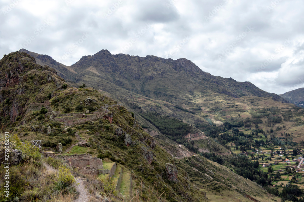 Landscape with green Andean Mountains and Inca ruins on the hiking path in Pisac archeological park, Peru Landscape with green Andean Mountains and Inca ruins on the hiking path in Pisac archeological park, Peru