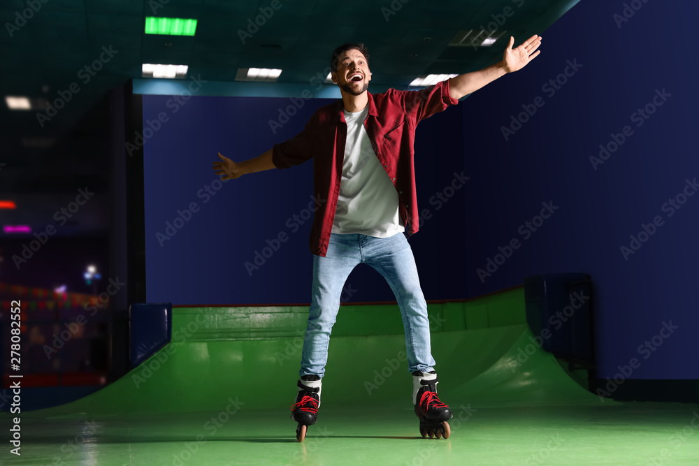 Man having fun at roller skating rink
