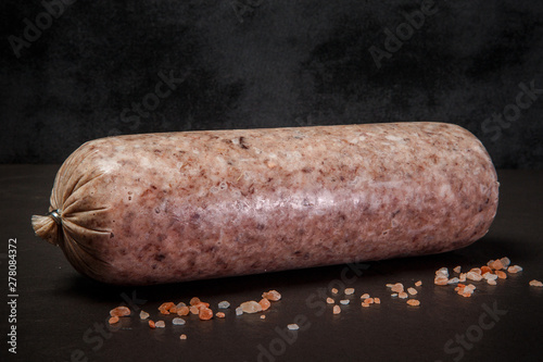big thick stick of handmade marble sausage with spices