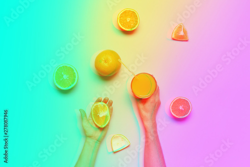 Female hands holding cut whole juice orange fruit