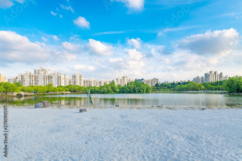 Lakeside view of white sand beach, Daning Tulip Park, Jing'an District, Shanghai, China photo