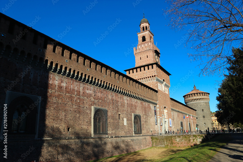 View to famous Milan landmark Sforza castle towers and wall in bright sunny winter day