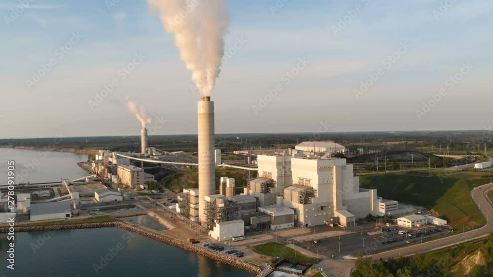 Aerial view of Power Station in Wisconsin (Milwaukee), the coast of Michigan lake at sunrise. Industrial landscape. Plant emissions, environmen pollutions Aerial view of Power Station in Wisconsin (Milwaukee), the coast of Michigan lake at sunrise. Industrial landscape. Plant emissions, environmen pollutions