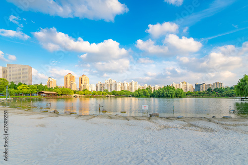 Lakeside view of white sand beach, Daning Tulip Park, Jing'an District, Shanghai, China photo