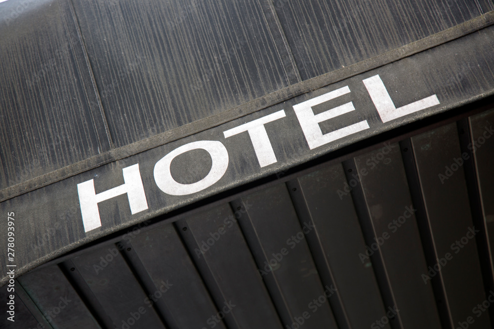 Obraz premium Hotel Sign on Building