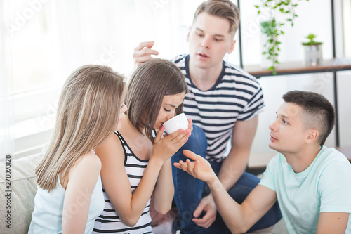 friends trying to calm down their best friend. Woman depressed. Young people helping to solve a problem.