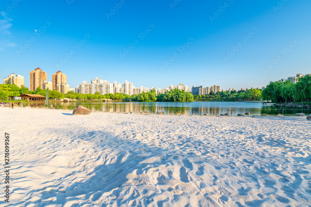Lakeside view of white sand beach, Daning Tulip Park, Jing'an District, Shanghai, China