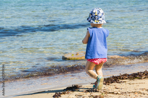 Child Playing on the Beach in Sunny Day. Summer Season and Holiday.  