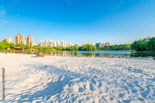 Lakeside view of white sand beach, Daning Tulip Park, Jing'an District, Shanghai, China photo