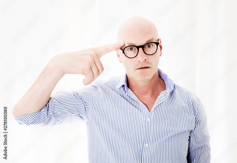 upset businessman with big head pointing his finger to head upset businessman with big head pointing his finger to head