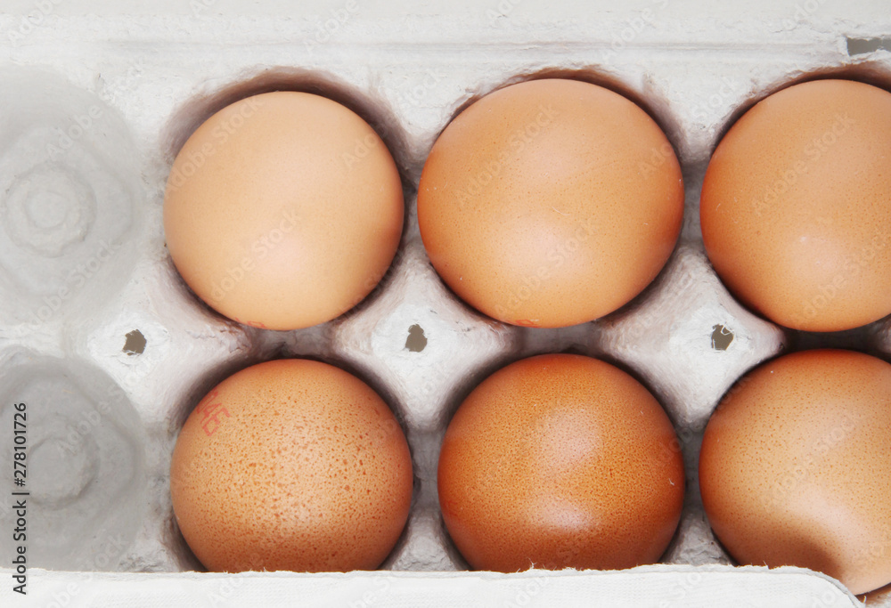 Close-Up Of Brown Eggs In Carton Close-Up Of Brown Eggs In Carton